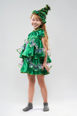   red-haired girl in costume Christmas trees