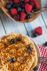 Delicious homemade pancakes breakfast with fresh berries fruits