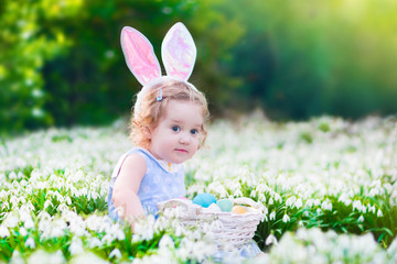 Little girl on Easter egg hunt
