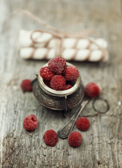 frozen raspberries old wooden background retro vintage