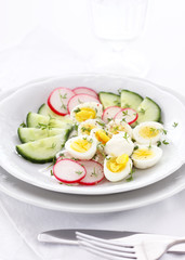 Fresh vegetable salad with quail eggs