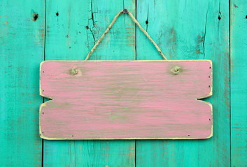 Blank pink wood sign on antique green painted background