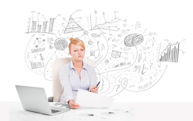 Business woman at desk with hand drawn charts