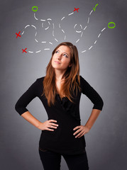 Young woman thinking with abstract marks overhead