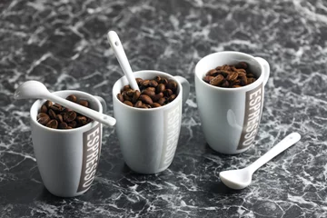 Fotobehang coffee cups full of coffee beans © Richard Semik