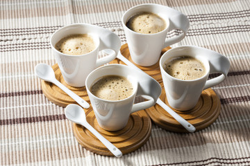cups of coffee on place mats