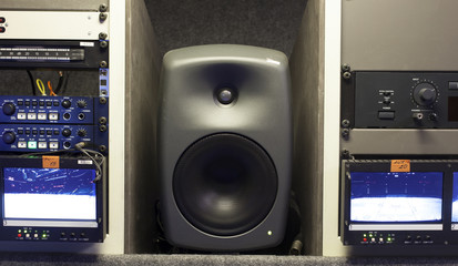 Wide shot of vision mixing panel in a television gallery.