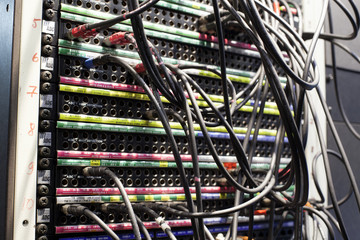 Wide shot of vision mixing panel in a television gallery.
