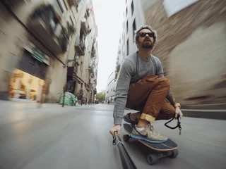 Foto auf Acrylglas Man rides through city on skateboard © BublikHaus