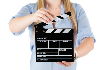 Womans hands holding a clapboard. Isolated on white 