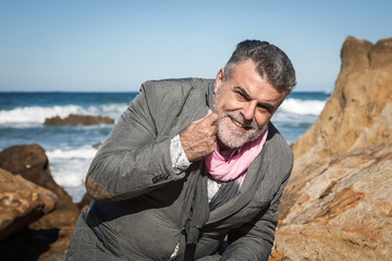 Attractive bearded man on the seashore