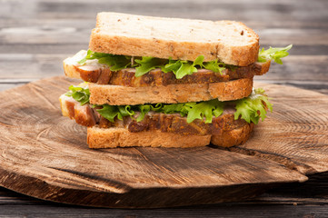 Sandwich with roasted pork and lettuce