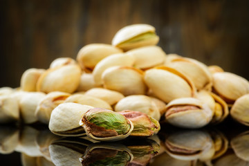 Pistachios on wooden table. Selective focus