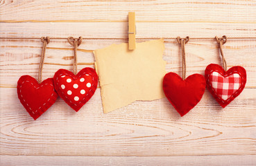 Valentines Vintage Handmade Hearts over Wooden Background.