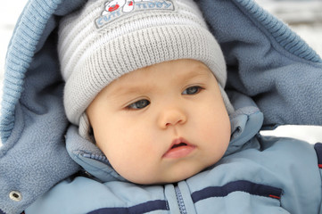Child portrait in winter overall