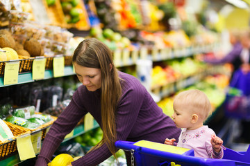 Mother and baby daughter in supermarket