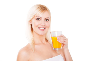 Close up of a smiling healthy woman with orange juice