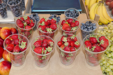 Strawberries and blueberries in cups