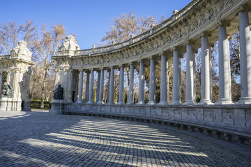 Fototapeta na wymiar Classic columns gallery, Lake in Retiro park, Madrid Spain