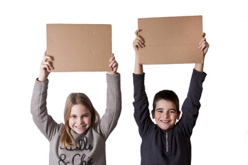 children with cardboard signs