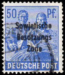 Stamp printed in Germany shows Reaping Wheat