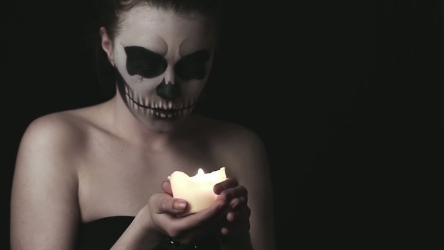 young woman with skull make-up
