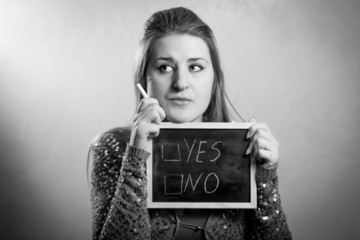 Monochrome portrait of woman thinking on 