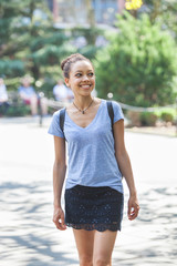 Fototapeta premium Beautiful Mixed-Race Young Woman at Park, Smiling Portrait