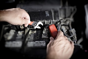 Fototapeta na wymiar Mechanic working in auto repair garage