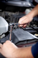 Mechanic working in auto repair garage