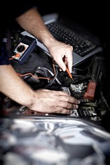 Mechanic working in auto repair garage
