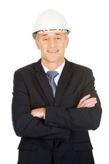 Smiling businessman with hard hat