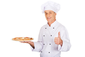 Chef baker with italian pizza showing ok sign