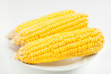 Close up grains of ripe corn on dish