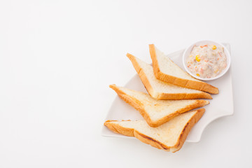 bread sandwich with tuna fish on white paper background