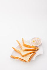 bread sandwich with tuna fish on white paper background