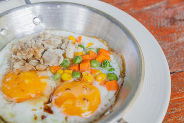 Breakfast: Fried egg add pork, string bean, corn and carrot.