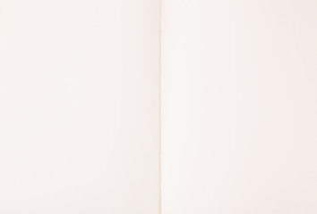 Open empty notebook on white paper background