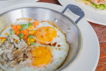 Breakfast: Fried egg add pork, string bean, corn and carrot.