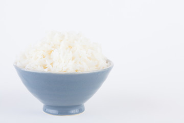 Bowl full of rice on white paper background