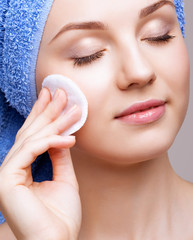 woman with makeup cotton pad