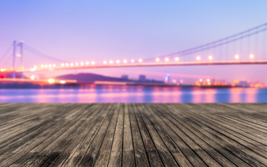 Blurred bridge lights and office buildings