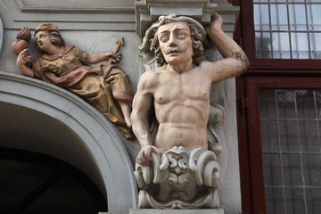 Muscular mustached atlas supported a Renaissance house in Gdansk