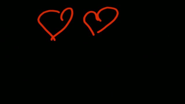 heart on the black screen of a smartphone
