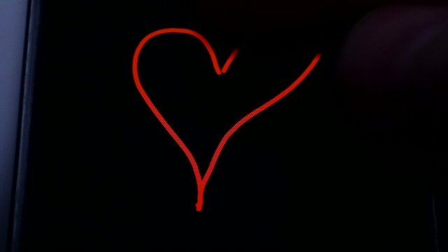 heart on the black screen of a smartphone