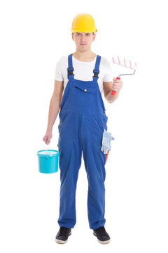 young man painter in blue coveralls isolated on white