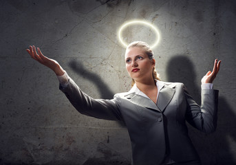 Praying businesswoman