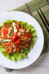 warm salad with chicken and vegetables. Vertical top view