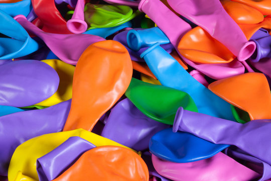 Colorful deflated balloons on the desk