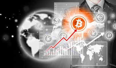 Choosing bitcoins, businessman pressing touch screen button.